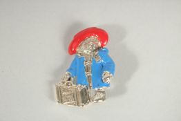 A SILVER AND ENAMEL PADDINGTON BEAR BROOCH.
