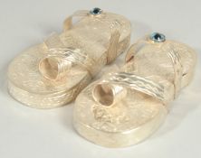 A PAIR OF NOVELTY SILVER SANDLES. 9cm long.