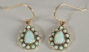 A 9CT GOLD TEARDROP OPAL PAIR OF EARRINGS.