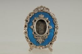 A GOOD FABERGE SILVER AND BLUE ENAMEL EASLE FRAME, in an old Faberge box. 2.75ins x 2ins.
