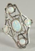 A SILVER OPAL OPEN WORK RING.