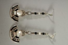 A PAIR OF SILVER ONYX, OPAL AND MOTHER OF PEARL DECO STYLE DROP EARRINGS.