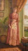 E. M. Jago, An interior scene with a lady standing by a window wearing a pink dress and holding a