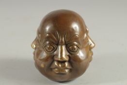 A SMALL BRONZE FOUR FACED BUDDHA.