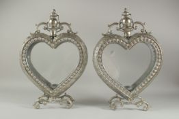 A PAIR OF SILVERED METAL HEART SHAPED LANTERNS. 19ins high.