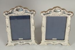 A PAIR OF SILVER PHOTOGRAPH FRAMES. 7.5ins x 5ins
