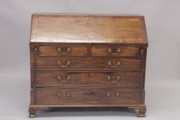 A GOOD GEORGE III MAHOGANY BUREAU with fall flap, fitted interior over two short and three long