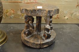 A carved wood African stool (faults).