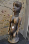 A large carved wood African female figure.