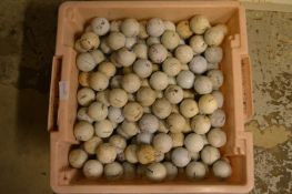 A large quantity of used golf balls.