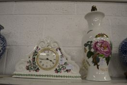 A Portmeirion floral decorated mantle clock together with a similar table lamp.