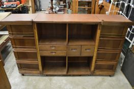 An Oriental hardwood folding bar or drinks cabinet.