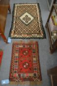 Two small woollen rugs, 70cm x 53cm and 125cm x 80cm.
