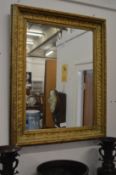 A rectangular gilt framed mirror.