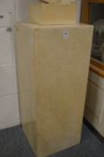 A modern marble pedestal column.