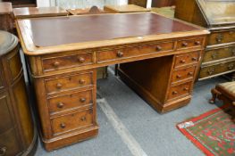 A Victorian oak pedestal desk.