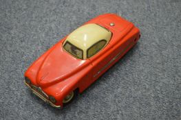 An unusual German tin plate clockwork car with revolving roof.