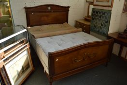 Classical style mahogany bed frame with base and mattress.