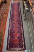 A good Persian style runner, rich blue ground with stylised decoration, 295cm x 56cm.