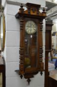 A walnut cased Vienna regulator wall clock.