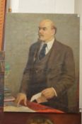 Russian School, Lenin standing by a table a letter in his hand, oil on canvas, unframed.