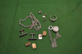 A small wooden box containing silver jewellery.