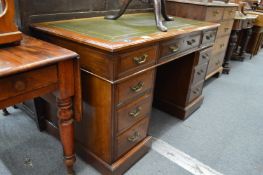 A Victorian walnut pedestal desk.