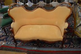 The matching chair back settee.