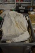Large box of Christening gowns and other items.