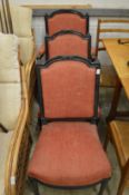 Three Victorian ebonised chairs, one with arms.
