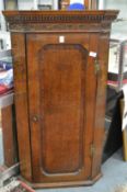 A 19th century oak hanging corner cupboard.