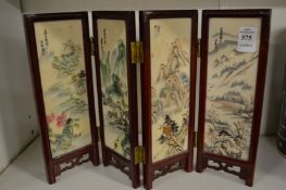 A miniature Japanese folding screen.