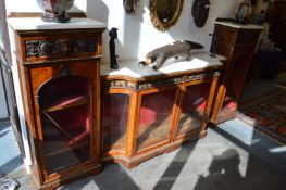 An impressive Victorian walnut ormolu and marble top breakfront four door side cabinet.
