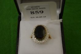 A 9ct gold and gem set ring, size N½.