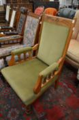 A Victorian oak framed open armchair.