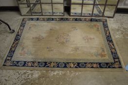 A Chinese rug, cream ground with floral decoration, 176cm x 120cm.