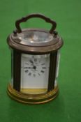 A small brass carriage clock.
