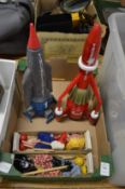 Two modern Thunderbird toy aircraft and two small puppets.