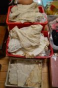 A good collection of early lace trimmings, embroidered Christening gowns etc.