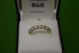 An 18ct gold and diamond seven stone ring, size Q.