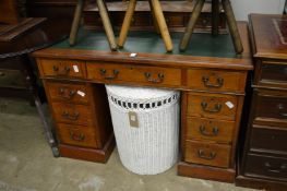 A Victorian walnut pedestal desk.