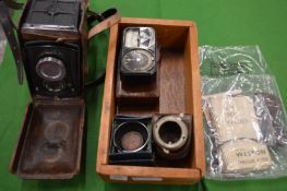 A Rolleiflex camera with original leather case and accessories etc.