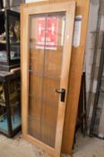 A hardwood framed leaded glazed door.