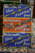An enamel sign 'Watermans Ideal Fountain Pen', three rows of text and images in blue, red and blue.
