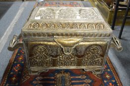 An ornate Eastern embossed metal casket.