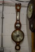 A mahogany barometer/thermometer.