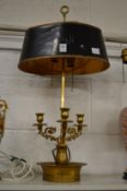 A decorative ormolu table lamp with toleware style shade.
