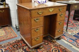 A good 18th century oak small kneehole desk.