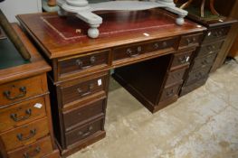 A reproduction mahogany pedestal desk.