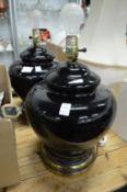Two large black pottery table lamps.